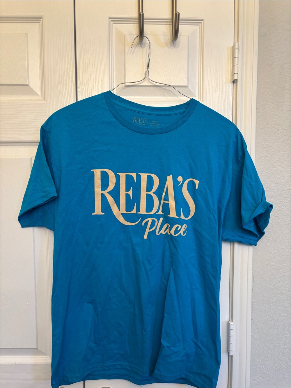Reba Teal 'Reba's Place' Short Sleeve Tee